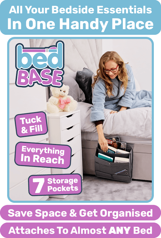 Person lying in bed & easily grabbing a book out of Bed Base, the bedside storage solution that attaches to almost any bed.