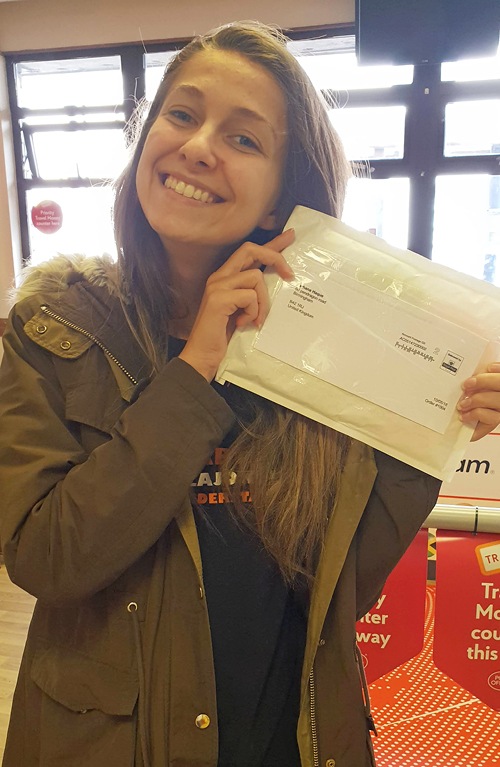 Amy at post office sending first order