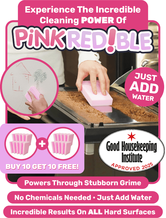 Person cleaning dirt off the oven door with Pinkredible, the sponge that instantly removes stubborn dirt, grease & grime.