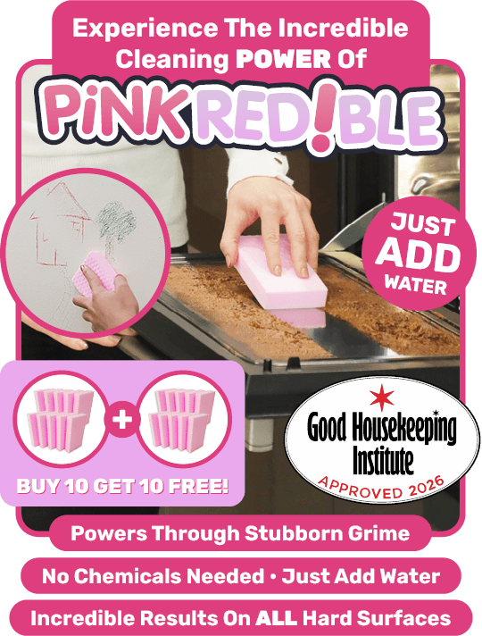Person cleaning dirt off the oven door with Pinkredible, the sponge that instantly removes stubborn dirt, grease & grime.